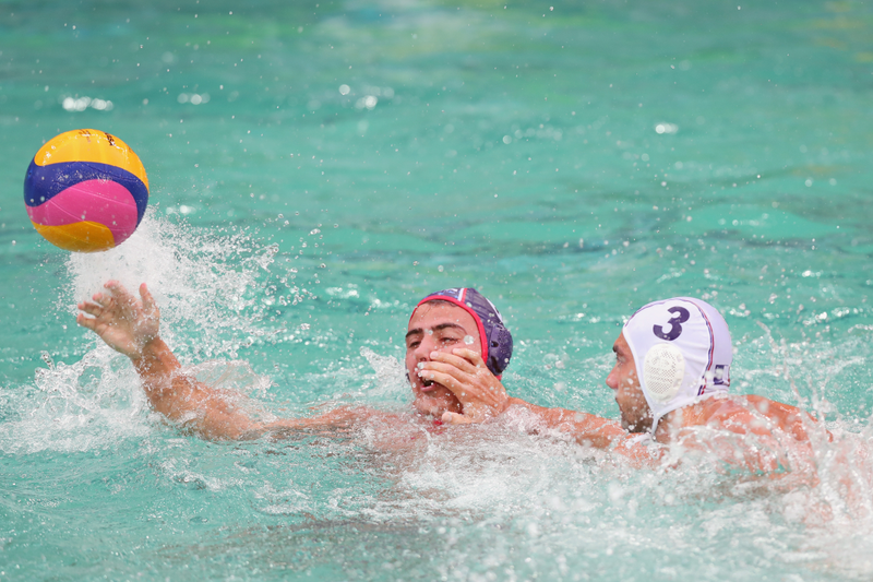 Olympic water polo played in greenish water. Photo credit: Tom Pennington/Getty